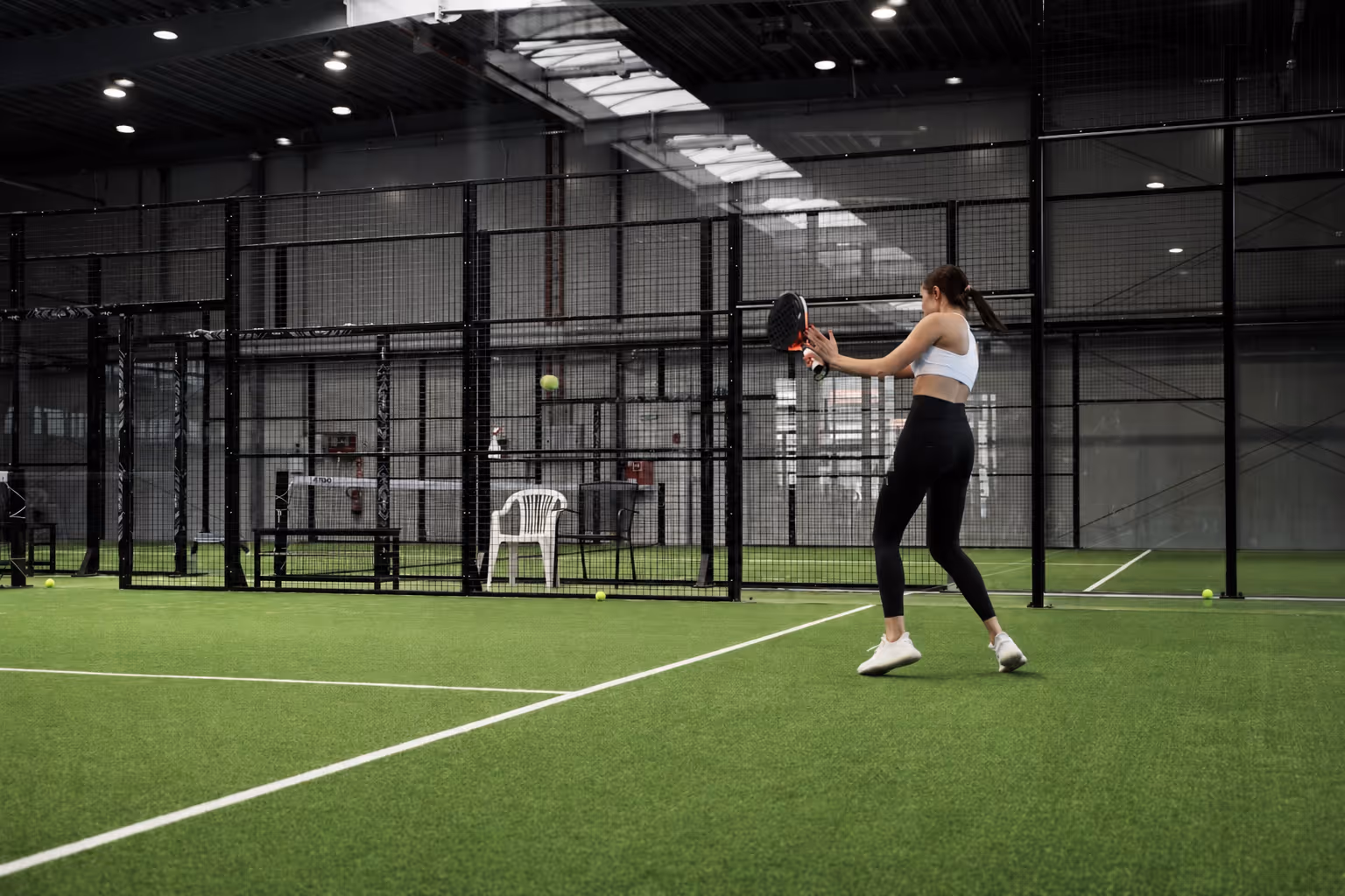 Player in action on an indoor turf court